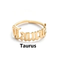 Detailed view of golden Taurus zodiac letter ring with adjustable open band design - Taurus / Gold