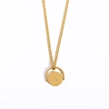 Gold stainless steel necklace featuring a rotating oval pendant with letter X engraving - Letter X