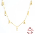 Detail of S925 sterling silver golden necklace with geometric crystal pendants - 925 Silver / White Zirconia