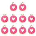 Macro detail of ten rose pink enamel heart charms with gold plated alloy edges - Rose Red