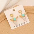 Detail of vintage bull skull earrings with gold heart studs and turquoise accents - Turquoise Inlay White Bull Style (5#)