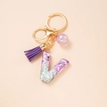Sparkly purple resin letter V keychain with matching tassel and golden hardware - Letter V