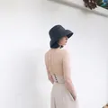 Detail view of a black finely woven straw sun hat in vintage Audrey Hepburn style - Adjustable / Black Small Brim