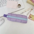 Detailed close-up of a quilted purple pencil case with a light blue zipper and side handle - Purple