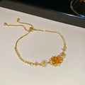 Elegant gold plated adjustable bracelet featuring a large yellow gemstone and white zircons - Single Bracelet / Gold-Yellow