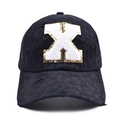 Detail of black baseball cap featuring leopard print fabric and chenille letter X embroidery - Letter X Style (X-漏洞马尾棒球帽)
