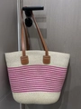 Woven straw tote bag in beige with pink stripes and brown leather handles on door - Pink Beige Narrow Stripe