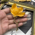 Detail of yellow magnolia enamel brooch showing 50mm x 81mm dimensions and texture - FM313 Brooch / Yellow