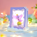 Purple book-shaped night light featuring a glowing elephant figure on cloud base - Purple Dumbo Night Light (983-10A Purple)