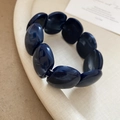 Detail of dark blue marble resin beads with white textures on an elastic bracelet - 82# Bracelet (Spliced Round) / Blue Marbled