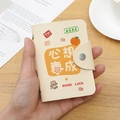 Cream PU leather card holder with 'Good Luck' print and snap closure in hand - 24 Slots / RFID Dreams Come True