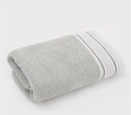 Plush light grey cotton towel with refined white and grey striped border detail - Loulan Green