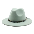 Detail of mint green fedora hat featuring a black woven band with bronze metal beads - Mint Green