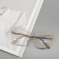 Occhiali cat-eye alla moda in oro champagne trasparente con sottili aste in metallo - Tè Chiaro Trasparente