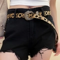 Détail de la ceinture léopard avec œillets dorés et boucle vintage sur un short noir - 69# Marron Géométrique Léopard Œillet