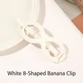 Close-up of matte white infinity shaped hair claw clip on a minimalist ceramic plate - Infinity - Cream White