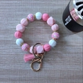 Pink and white silicone bead keychain bracelet with tassel and leopard pattern charm - Pink