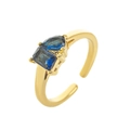 Adjustable gold titanium ring with pear and emerald cut blue cubic zirconia stones - Open Size 7 / September
