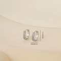 Detail view of silver zircon earrings measuring 1.1cm in diameter with size markings - One Pair / White Gold (E071334bkb)