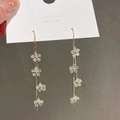 Elegant gold tulip drop earrings with white flower charms and shimmering rhinestones - Four-flower Tassel (6 Silver Earring Posts. Gold)