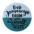 Round badge with blue background and slogan BIG journeys BEGIN WITH small STEPS - BIG journeys BEGIN