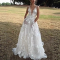 Deep V-neck A-line white lace wedding dress with floral embroidery in outdoor setting - S / Dresses / White