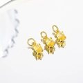 Detailed view of three 5x7mm gold-plated pendants with faceted yellow zircon for DIY jewelry - Yellow