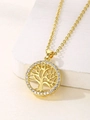 Detailed close-up of golden Tree of Life pendant with sparkling crystals on white stone - Gold