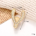 Macro shot of horseshoe-shaped charm with rhinestones for shoe charms, 3.1cm x 2.2cm - C140 Rhinestone Horseshoe