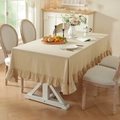 Beige washed cotton tablecloth with ruffled edges on a rectangular table in a cozy room - Rice Lotus Flower (washed Cotton)