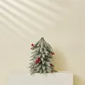 Mini tabletop flocked Christmas tree with red berries and pine cones for winter decor - Spray White Frost Tree With Decorations