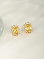 Detail view of gold-plated square yellow gemstone earrings with white zircon accents - Stud Earrings / 24K Gold Plated Yellow