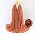 Solid brown pearl chiffon scarf shown on a mannequin with detail fabric texture macro - Brown