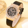 Close-up of elegant rose gold watch with rhinestone bezel and black leather strap - Black Watch