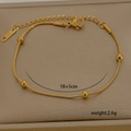 Detail of 18K gold-plated stainless steel snake chain bracelet with polished round beads - Beaded Snake Chain (6-9)
