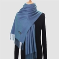 Solid blue cashmere-feel scarf with tassels and material label on model - 200*70cm / Denim Blue
