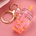 Llavero creativo de arena movediza de frutas con taza de bebida rosa y cierre dorado - Rosa