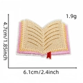 Embroidered book patch with pink and red details, size 4.7cm x 6.1cm, for clothing decor - Style 2 (Stacked Books)