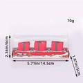 Set di tre candele natalizie a forma di confezione regalo in scatola festiva - Stile sacchetto regalo
