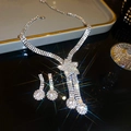 Luxury silver-tone jewelry set featuring star pendant necklace and matching drop earrings - Star Style Set