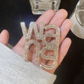 Golden WANG letter brooch with pavé set white crystals for luxury fashion styling - Large Letter Brooch - Gold