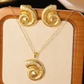 Detailed view of gold starfish and seashell necklace with matching earrings on a board - Gold Nautilus Set (Necklace+Earrings)
