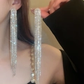 Luxurious silver long tassel earrings with sparkling rhinestones worn by a model - Luxury Oval Main Stone Tassel Style (36#银针-银色)