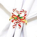 Christmas candy cane napkin ring with red bow and green leaves on white fabric - Candy Cane Style 125