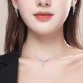 Silver waterdrop diamond necklace and tassel earrings jewelry set worn by a model - V-Shape Irregular Drop Set (DTN10026346S)