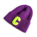 Purple knit beanie featuring a vibrant neon green letter C patch with cuffed edge - Purple