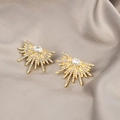 Detail of sunburst gold stud earrings with clear crystals on grey silk fabric - Gold Sun Flower Full Rhinestone Studs