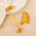 Amber resin facial roller and heart guasha tool set with elegant rose gold metal frame - Resin Roller + Amber Brown Gua Sha Board