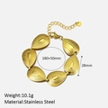 Golden stainless steel teardrop link bracelet with intricate concentric ripple textures - Bracelet