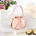 Detailed close-up of pink PU leather wedding candy bucket with gold metal rivets - Nude Pink (Pack of 10)